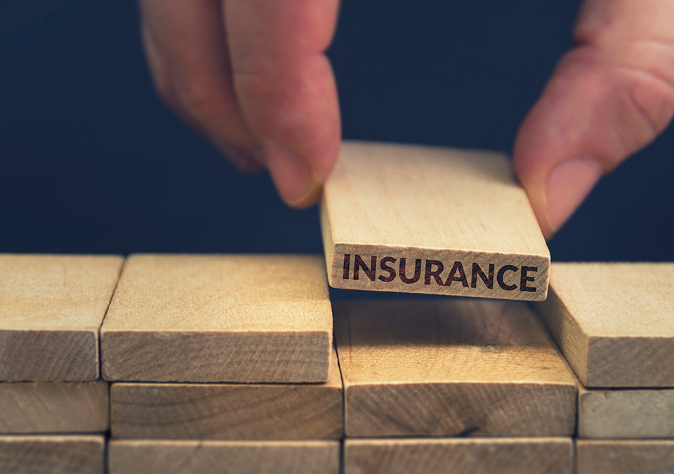 image with the word insurance on a block, placed on other blocks